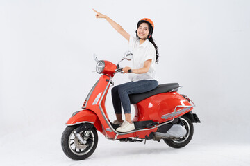 Fototapeta na wymiar full body photo of a woman wearing a hairdresser and driving a motorbike