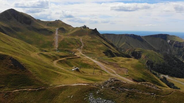 Cinematic shots of mountain landscapes. Remarkable aerial footage of Massif Central. Tourist attractions: Aerial views of Mont Dore. Adventure tourism drone videos in Breathtaking Massif Central