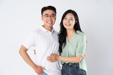 a couple posing on a white background
