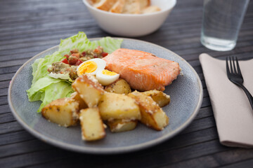 Baked salmon fillet with fried potato slices