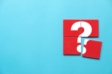 Q&A or questions and answers concept. Red square puzzle with a symbol of question mark. Copy space. - obrazy, fototapety, plakaty