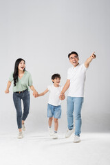 a family posing on a white background
