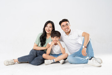 Naklejka na ściany i meble a family posing on a white background