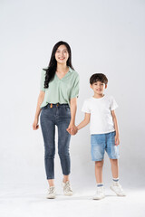 Obraz premium mother and son posing on a white background