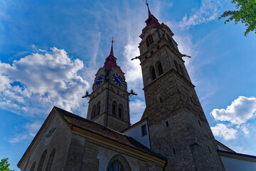 Fototapeta premium Church tower sof City church in backlight at the old town of City of Winterthur on a sunny spring day. Photo taken June 1st, 2023, Winterthur, Switzerland.