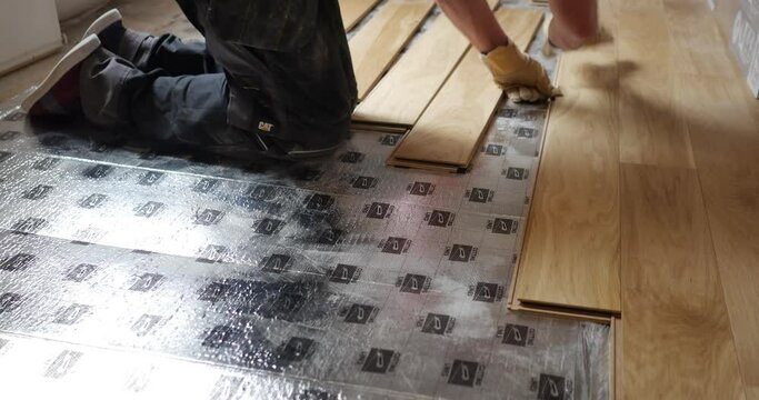 Interior design transformation video: Beautiful floating parquet installation Impressive parquet flooring renovation High-quality worker laying laminate floor. Stunning renovation of old house floors