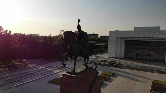 Monument to Manas the Great Bishkek Kyrgystan. Sunset Aerial drone view. Flying over. Drone is rotating right flying around. High quality 4k footage
