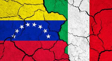 Flags of Venezuela and Italy on cracked surface - politics, relationship concept