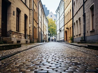 Foto op Plexiglas A shot of a narrow cobblestone street © Finn