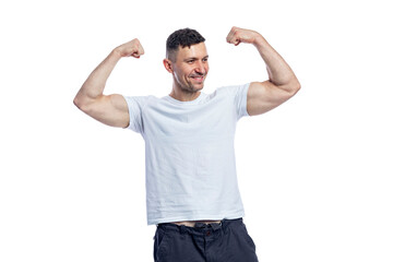 A handsome smiling man in a white t-shirt shows the muscles in his arms. Sport, health and active...