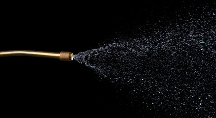 Spray jet water pressure nozzle isolated on black background