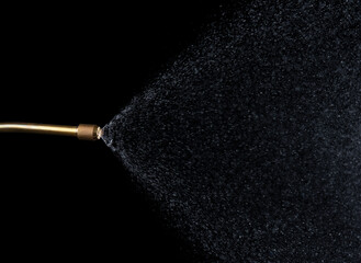 Spray jet water pressure nozzle isolated on black background