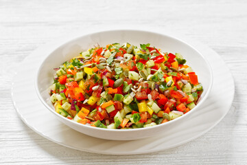 Israeli salad of finely diced veggies in bowl