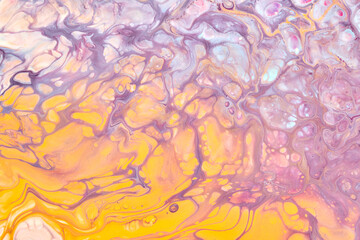 Exclusive beautiful pattern, abstract fluid art background. Flow of blending purple lilac yellow paints mixing together. Blots and streaks of ink texture for print and design