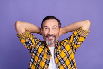 Portrait of positive man hold arms behind head watching empty space interesting offer discount...