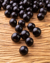 A group of Jabuticabas over wooden table