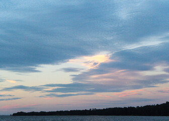 Clouds at sunset over a lake