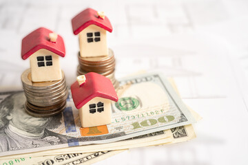 House model with stack of coin money, home loan, saving plan, installment payment finance and banking concept.