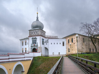 Naklejka premium Old castle in Grodno. Castle bridge. The main gate of the castle. White facade of the old tower. Beautiful historical building in a European city. Grodno, Belarus