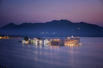 As the sun sets, immerse yourself in the serenity of Lake Pichola, Udaipur. This artificial freshwater lake graces the landscape with its picturesque islands adorned with palaces.