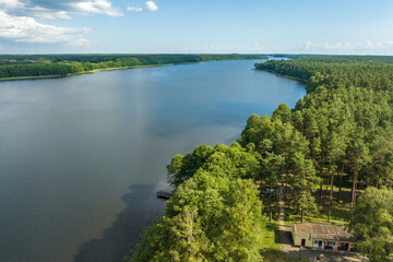 panorama aerial view over lake among forest