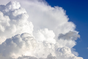 Naklejka na ściany i meble White cumulus clouds close-up, beautiful aerial cloud view, , fluffy cloud texture, copy space