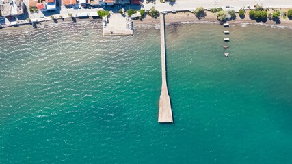 Aerial view of a pier against the sea on a sunny day