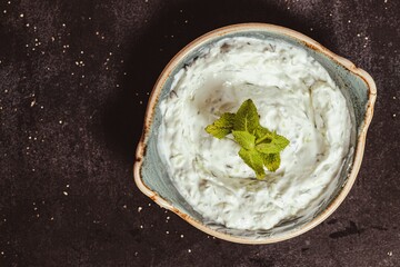 Ceramic bowl with a gourmet yogurt and mint side dish