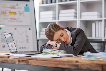 Bored at office work funny sleepy woman worker resting on hand sleeping at workplace, unmotivated lazy woman feeling drowsy falling asleep near laptop, boring job and lack of sleep concept