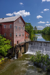 Fototapeta na wymiar Old Grist Mill with Water Wheel and Dam