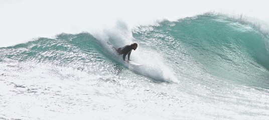 Closeup of a Surfer taking off on a wave