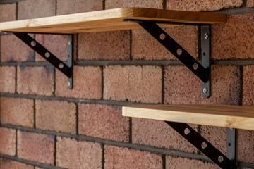 wooden shelves with metal braces in loft style