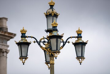 Fototapeta na wymiar Closeup of vintage ornamental lamp in the street