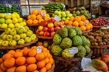 Variety of colorful fruits on display at the market.