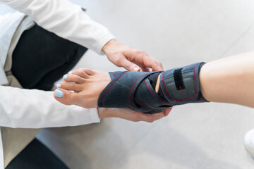 Close-up of a woman's foot with a sports ankle brace