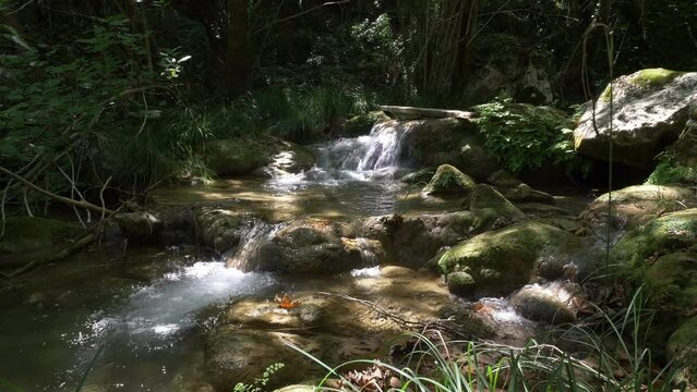 Beautifull river waterfall in mountain forest. Polylimnio in Messinia, Greece. 