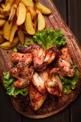 Fried chicken wings, with potatoes, and spices, homemade, fast food, no people,