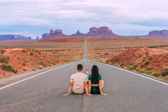 Happy couple on the famous road to Monument Valley in Utah. Amazing view of the Monument valley.
