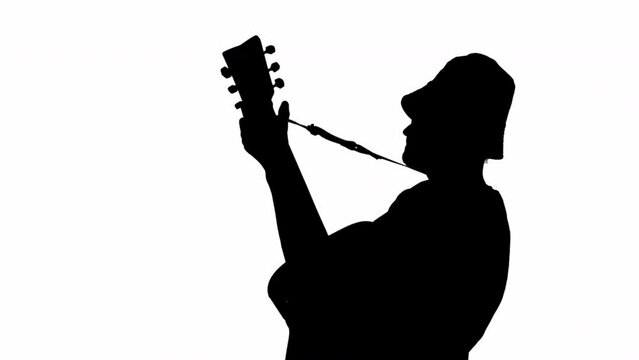 Silhouette of Musician with acoustic guitar