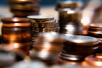 Nickels dimes and quarters with a shallow depth of field and selective focus about to collapse
