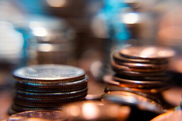 Nickels dimes and quarters with a shallow depth of field and selective focus about to collapse