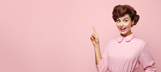 1950s Retro Housewife Pointing to Copy Space on a Pink Banner 