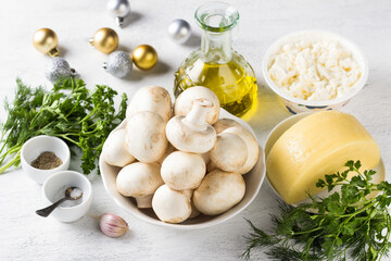 Ingredients: champignon mushrooms, hard cheese, curd cheese, garlic, olive oil, herbs for cheese roll. Festive snack preparation