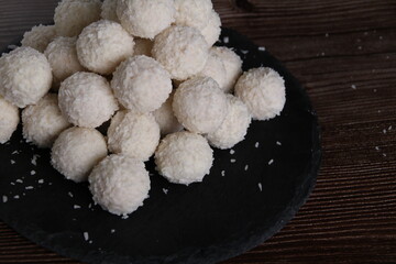 photo sweet dessert, lots of fresh candy in the shape of a ball, lying on a plate close-up