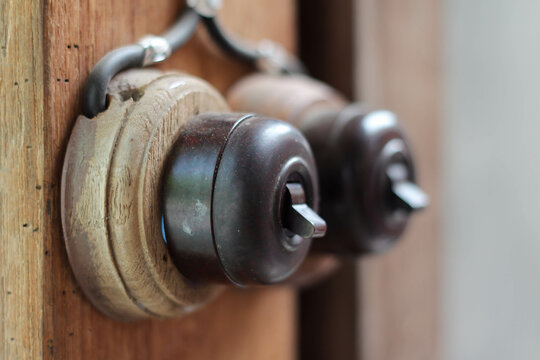 Vintage style electrical switch on a wooden pole