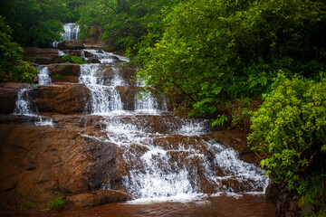 Small waterfalls during rainy days in Western Ghat of Maharashtra near Pune city, India.