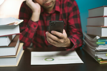 Young Asian businessman talking on the phone
late night hustle ambitious Working overtime talking...