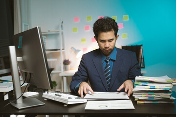 Young Asian businessman talking on the phone
late night hustle ambitious Working overtime talking...