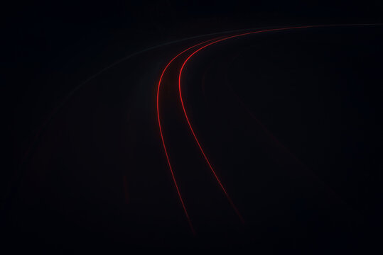 Light lines left by the car, the light of the car lights on the night highway