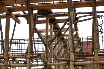 Bamboo scaffolding or crutches in traditional residential construction background